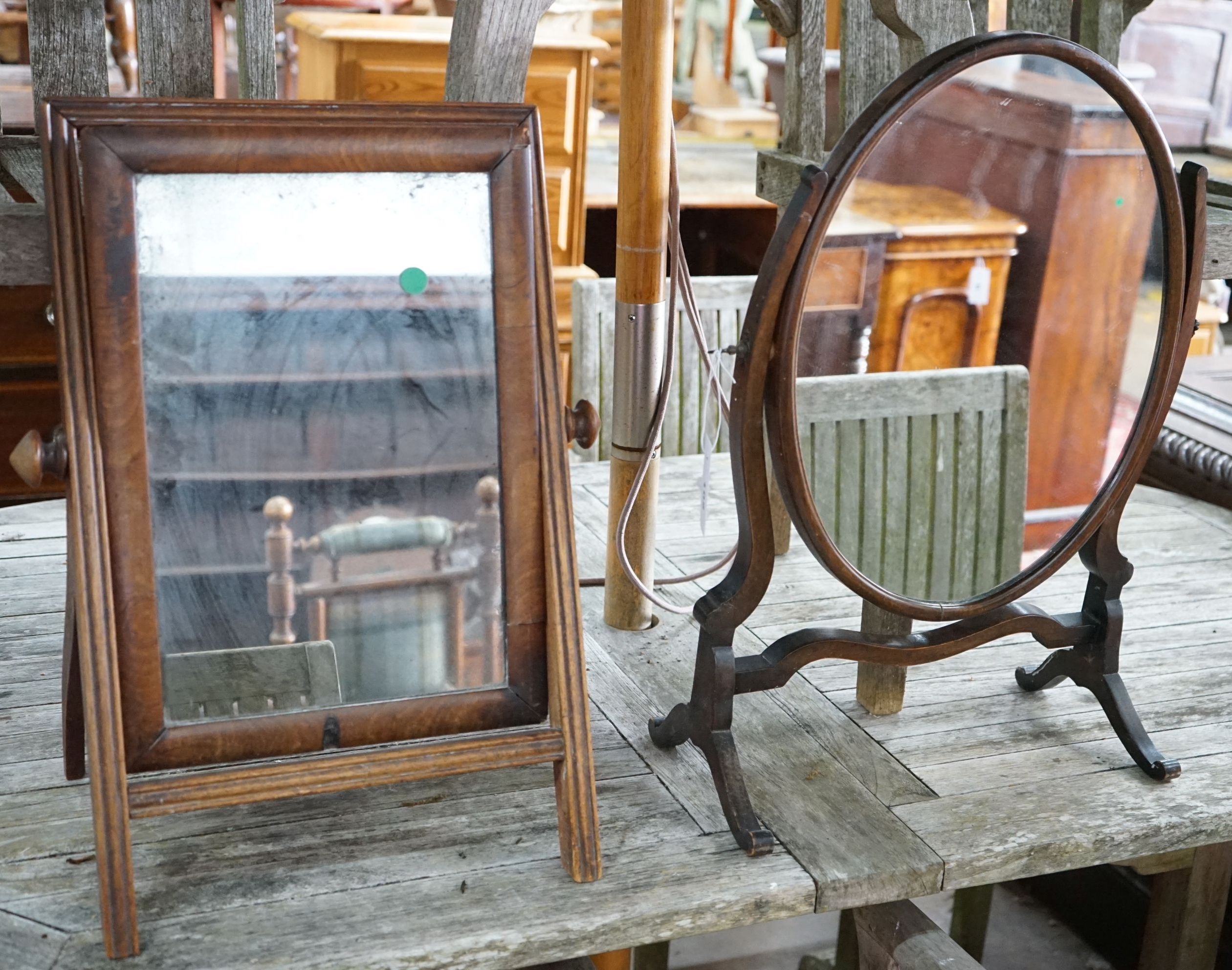 A Victorian mahogany toilet mirror, height 55cm together with a later skeleton framed toilet mirror